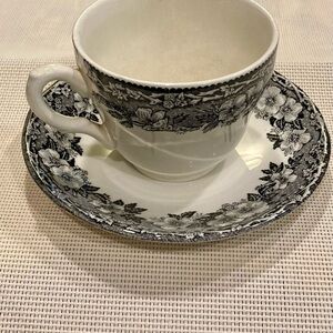 Elegant Black and White Floral Teacup and Saucer